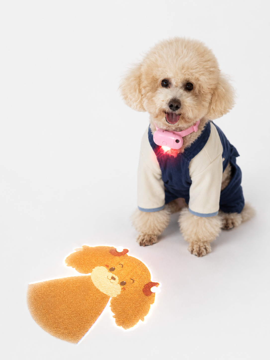 Pink MADA GlowTag pet projection device showing power button